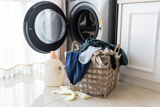 basket with laundry and washing machine - washing machine stock pictures, royalty-free photos & images