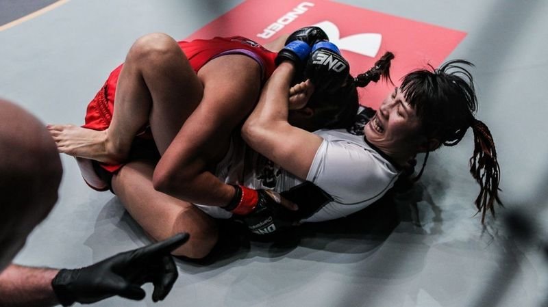 No-gi submission grappling at ONE Championship showing guard position and hip mobility in a featherweight bout