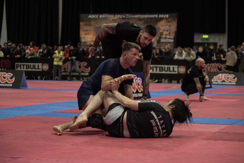BJJ finger tape application before ADCC no-gi grappling competition