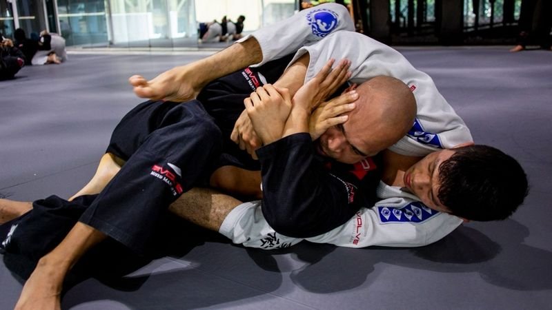 BJJ back mount position no-gi with hooks controlling hips