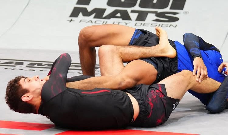 Mikey Musumeci winning by submission in no-gi BJJ competition wearing spats
