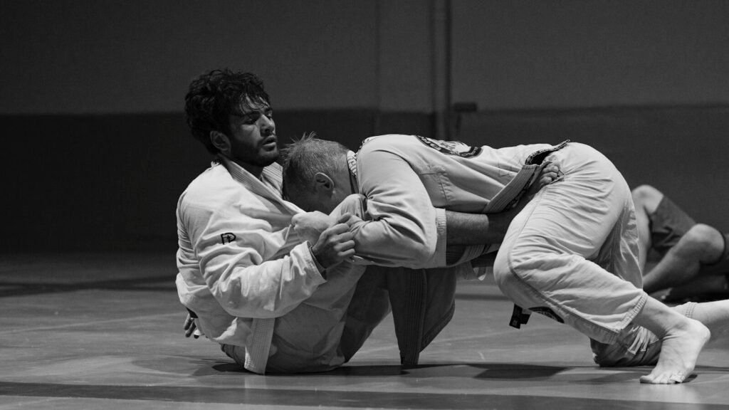 finger taping technique demonstration for BJJ using the X-tape method on PIP joint