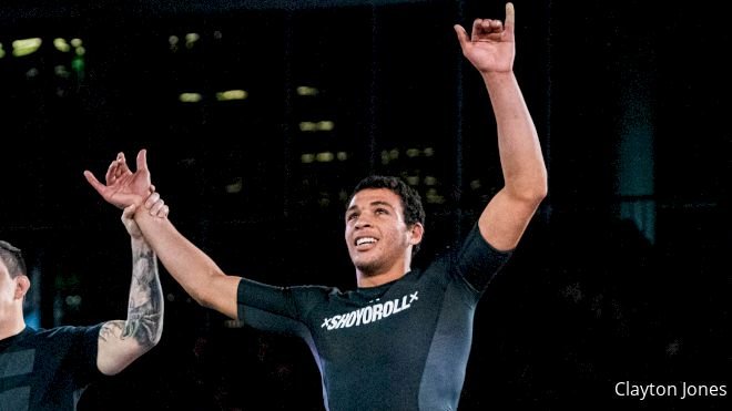 A grappler's rashguard sleeve and torso panel visible after a hard training session