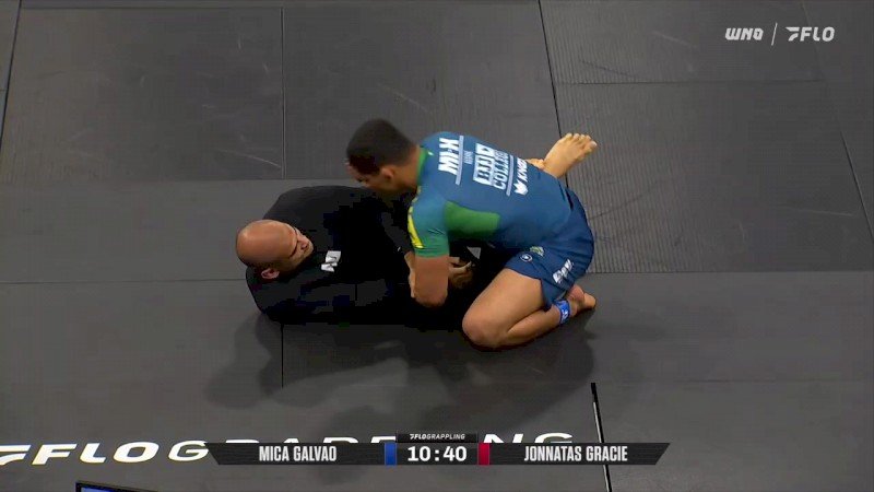 Mica Galvao controlling Jonnatas Gracie from top position in a no-gi match