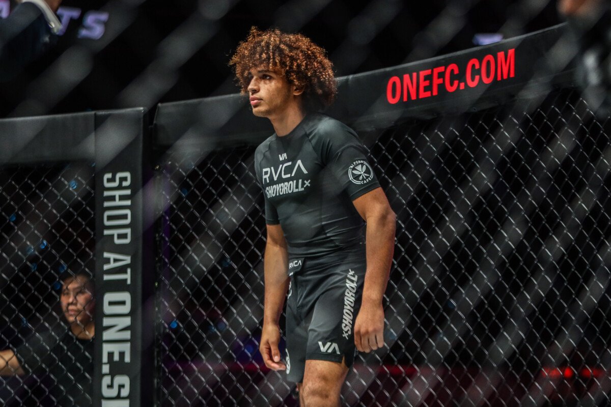 Kade Ruotolo walks to the cage in a no-gi rashguard before a submission grappling match