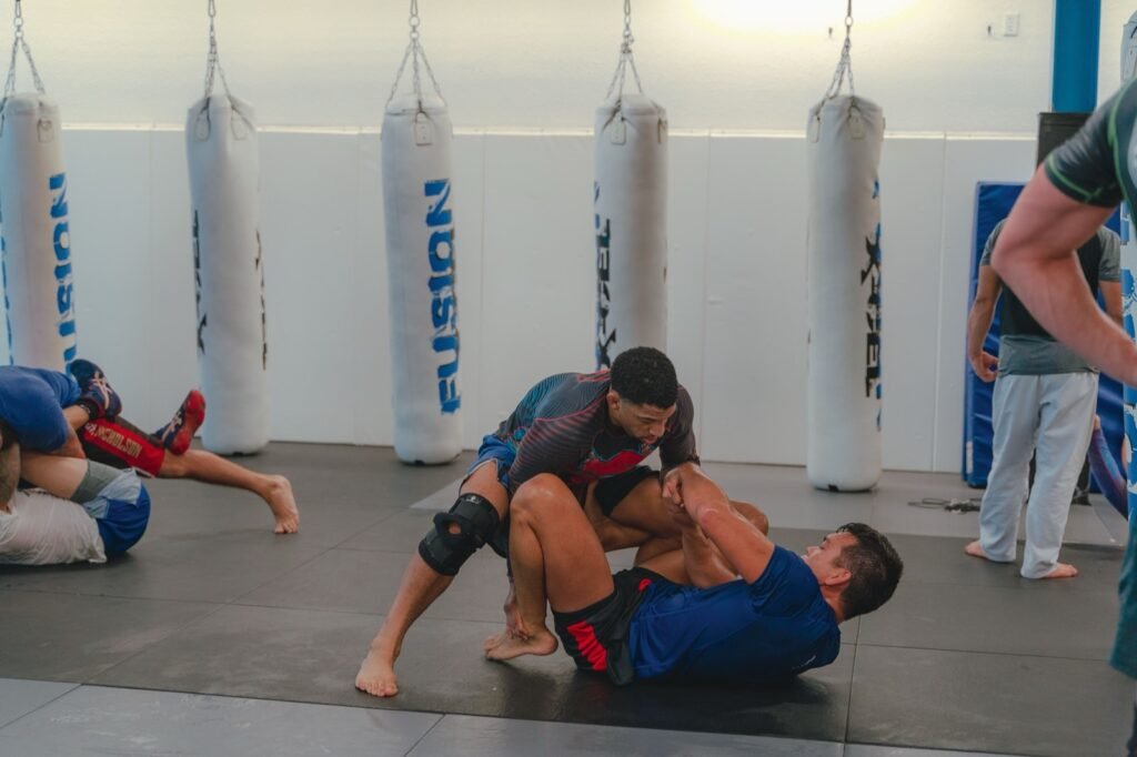 No-gi grapplers battling a guard pass during submission grappling training
