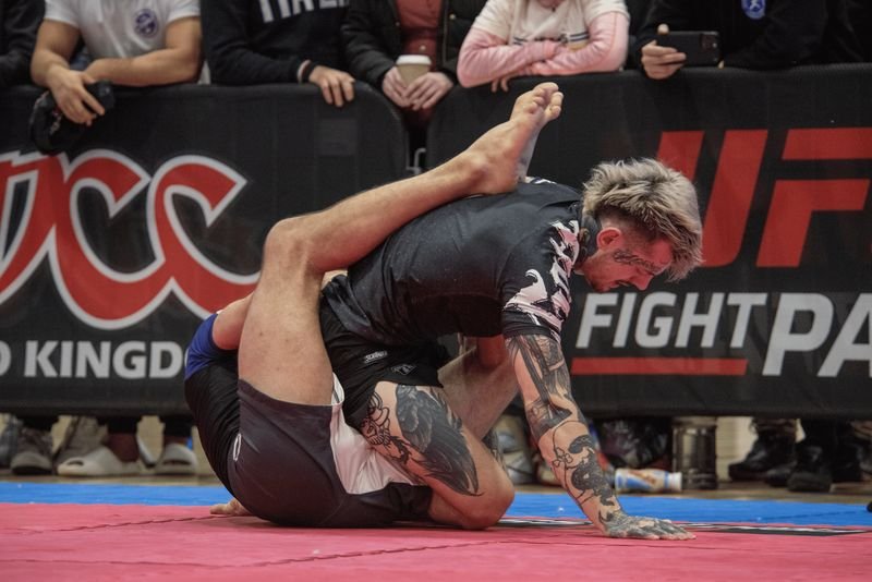 heel hook entry from guard in no-gi BJJ competition where finger tape protects hands