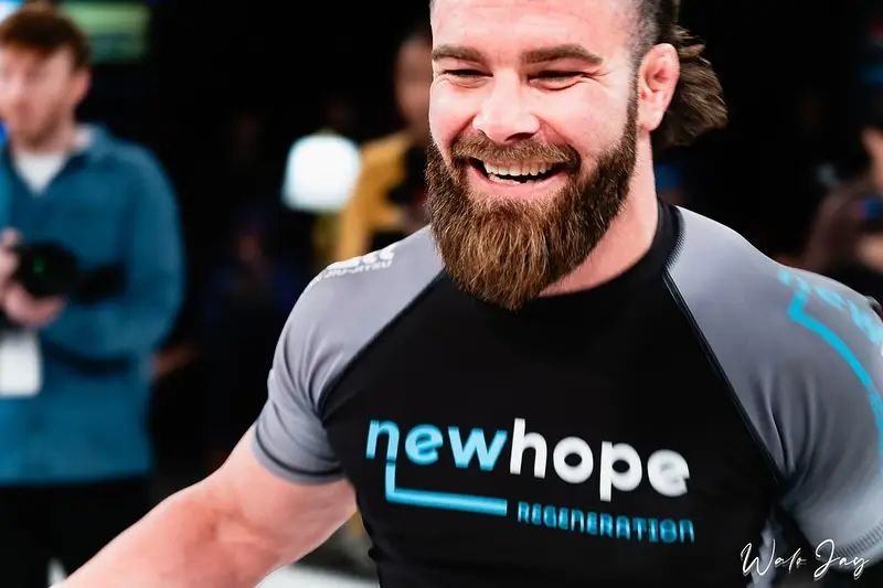 Professional no-gi grappler smiling after a PGF Season match