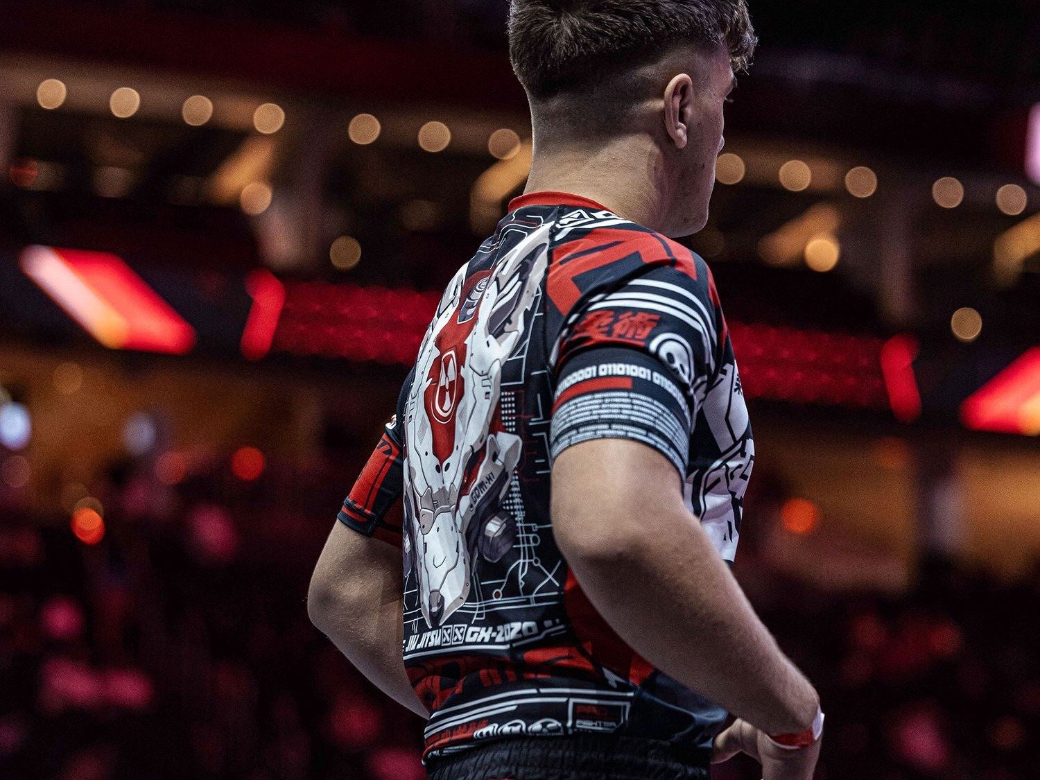 Close view of a sublimated rashguard print across the shoulder and upper back, the zone most gripped during collar ties and cross-face pressure