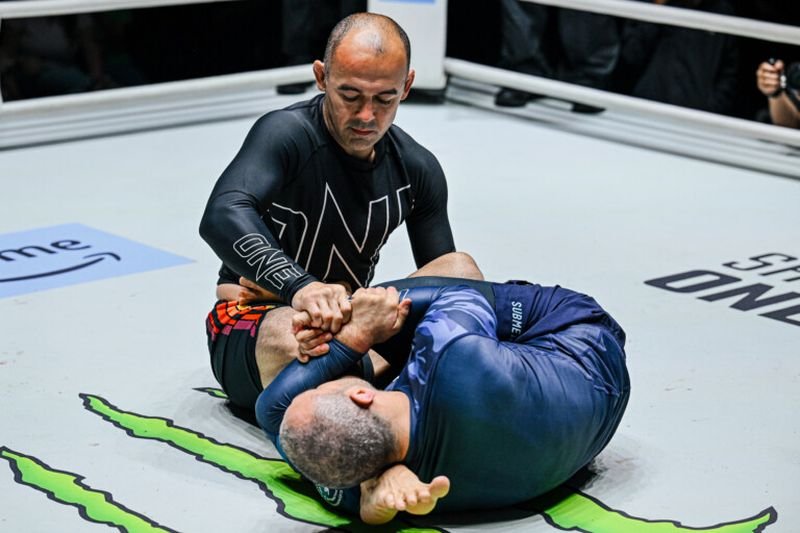 No-gi submission grappling exchange on the mat in ONE Championship competition