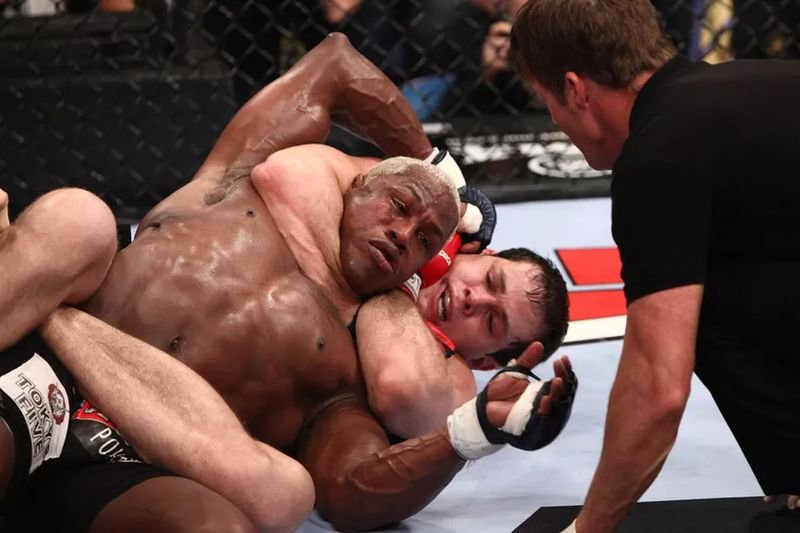 Roger Gracie demonstrates classic rear naked choke under the chin in no-gi grappling