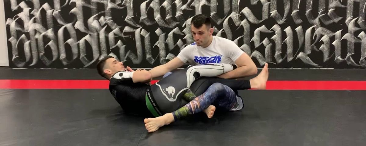 Saddle position no-gi leg lock control with both legs figure-foured around the trapped knee