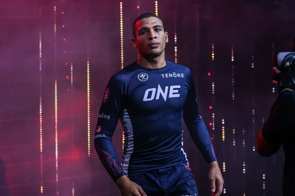 Competitor walking out in a fitted compression rashguard before a no-gi match