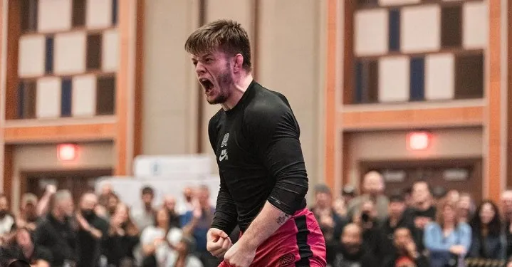 A no-gi grappler celebrates a takedown-scoring win at an ADCC Trials event