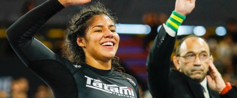 Anabel Lopez Beard celebrates a no-gi heavyweight win in rashguard competition gear