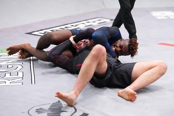 Ronaldo Junior grappling William Tackett during their UFC BJJ middleweight title match