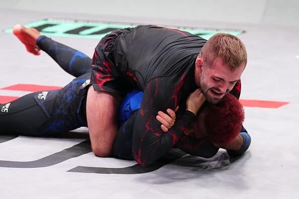 William Tackett securing a rear naked choke submission in UFC BJJ competition
