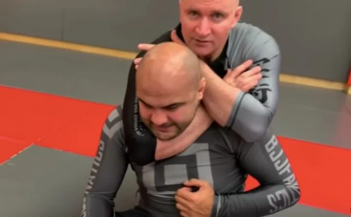 Instructor demonstrating a no-gi back control choke technique