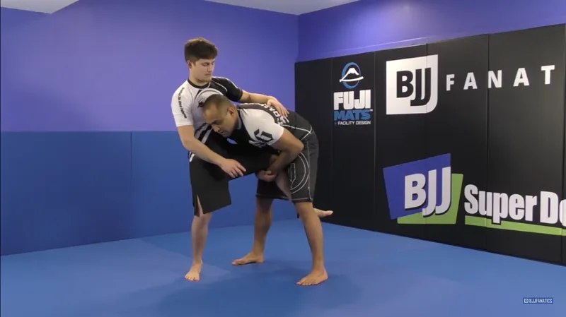 No-gi grapplers in a high crotch single leg takedown position