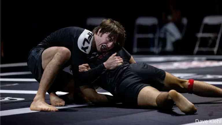 No-gi wrestler locking a body lock takedown and mat return at ADCC Trials