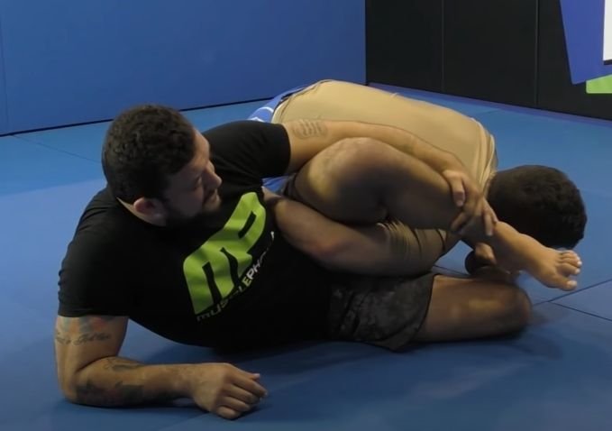 Grip and wrist control principles from a standard no-gi omoplata that carry over to the reverse variation
