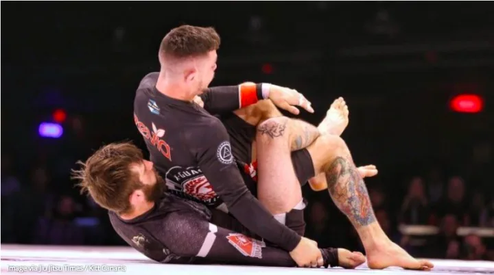 No-gi competition back mount with body triangle at a grappling tournament