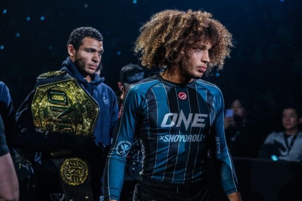 Twin brothers and no-gi grappling champions walking out before a submission grappling event